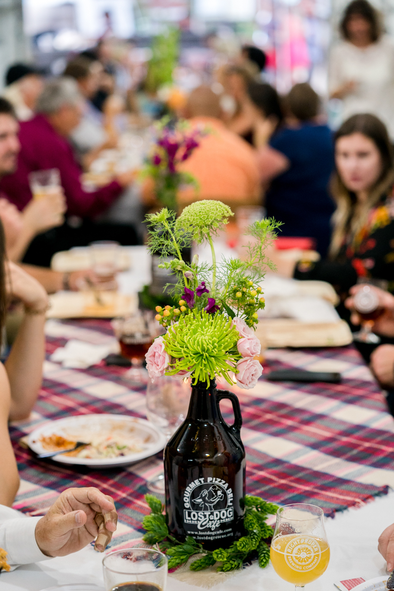 reception guest tables showing DIY growler centerpieces at this DC brewery wedding Love Life Images