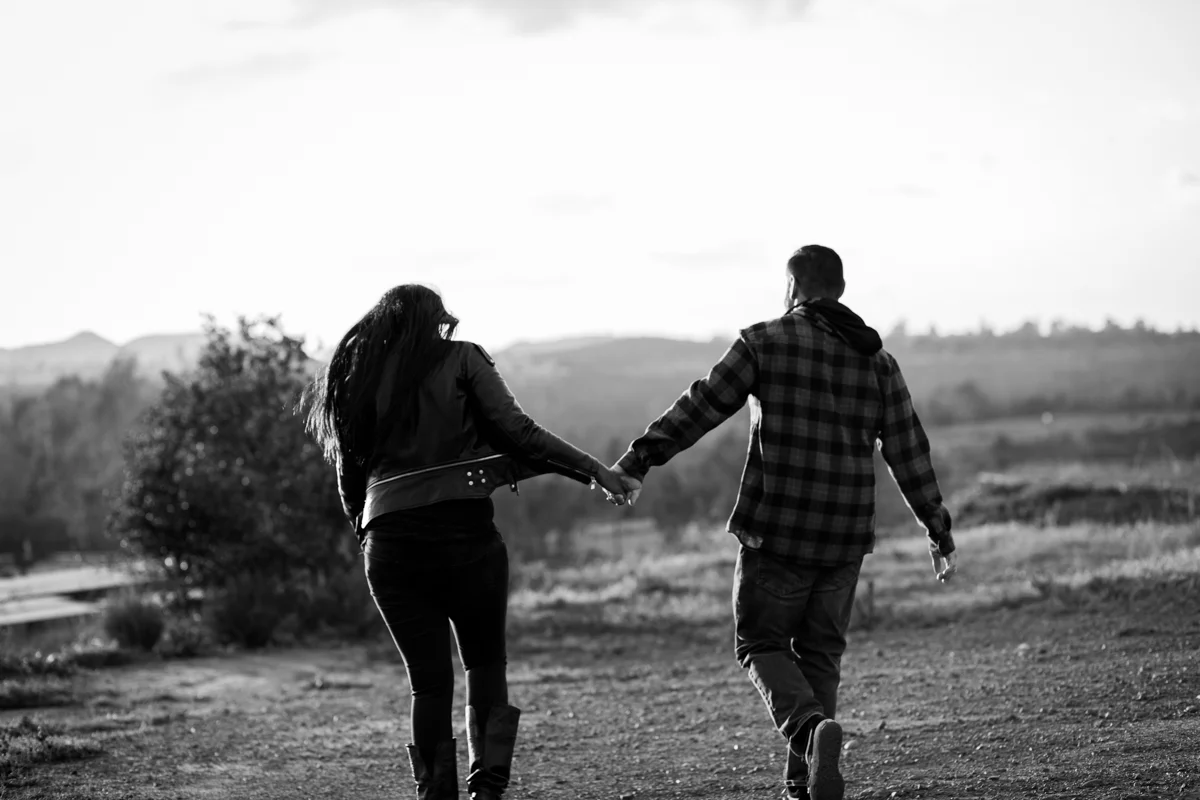 irvine regional park engagement session crystal lilly photography couple walking and holding hands, back to camera