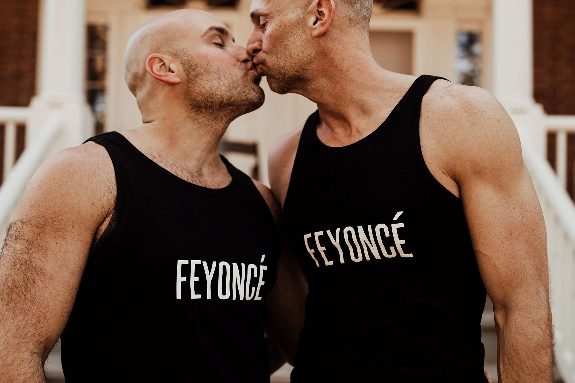 LGBTQ Louisville Kentucky Wedding at Hermitage Farm Crystal Ludwick Photo Jason and Jay kiss wearing shirts that read “Feyoncé”