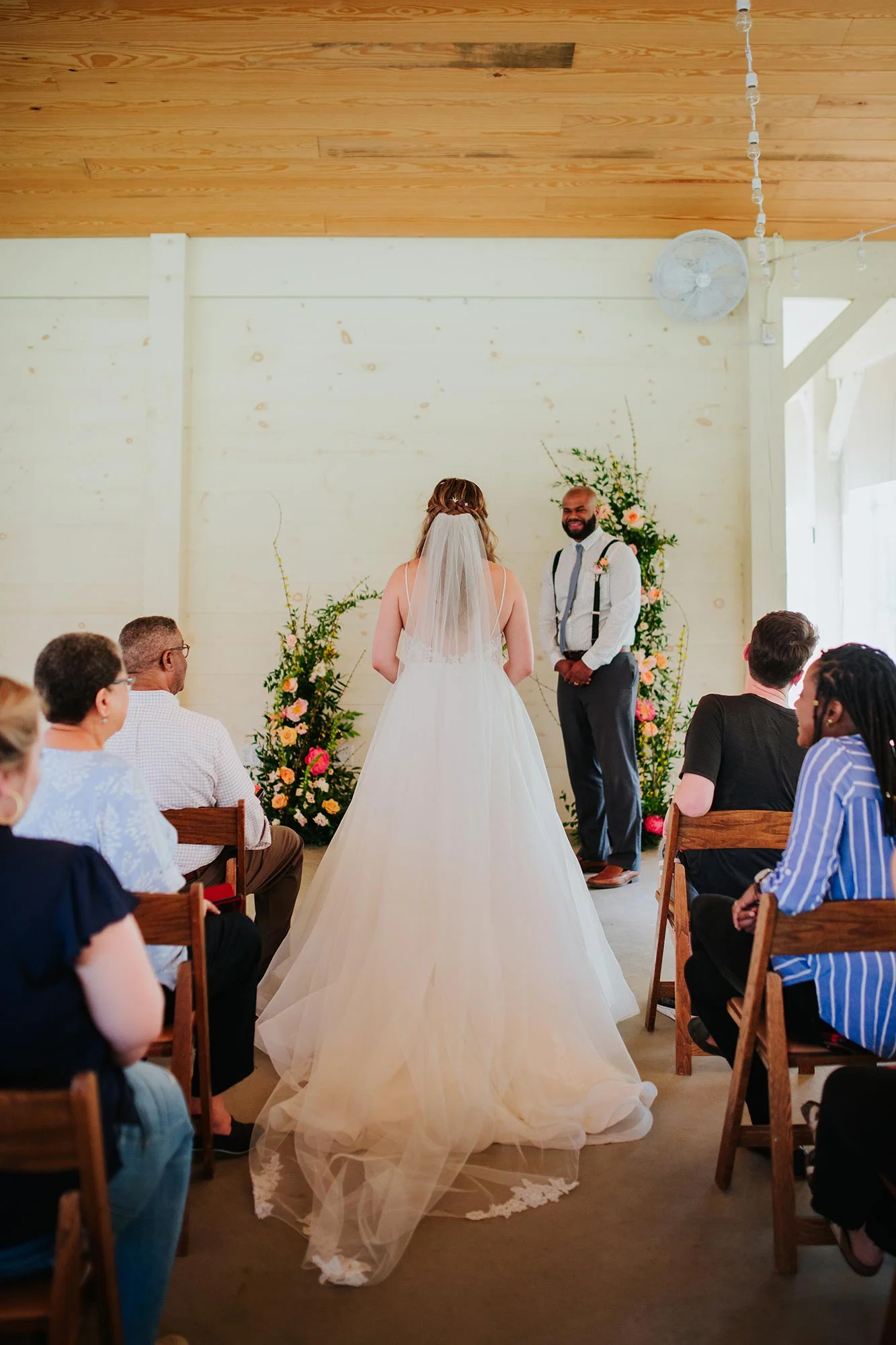 Lush wedding inspiration at Seven Springs VA with bride walking into ceremony Carly Romeo & Co.