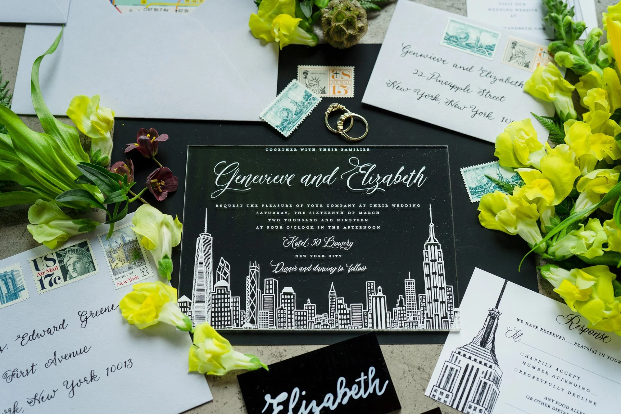 Bright Neon Wedding Inspiration at The Bowery Hotel NYC showing wedding invitations and rings JC Lemon Photography