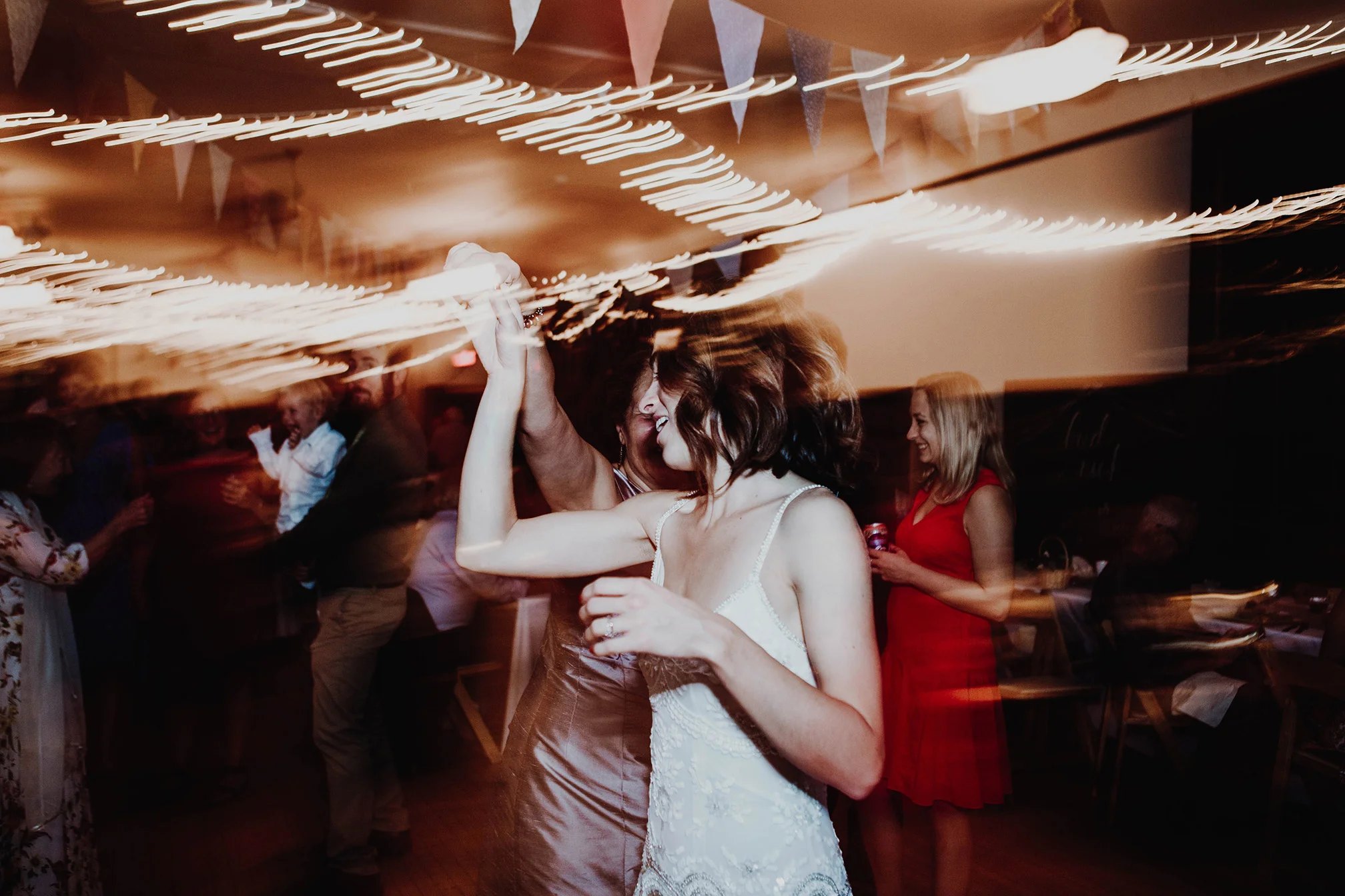 Couple dancing under lights at weddingRobyn Nicole Film + Photo Portland Maine