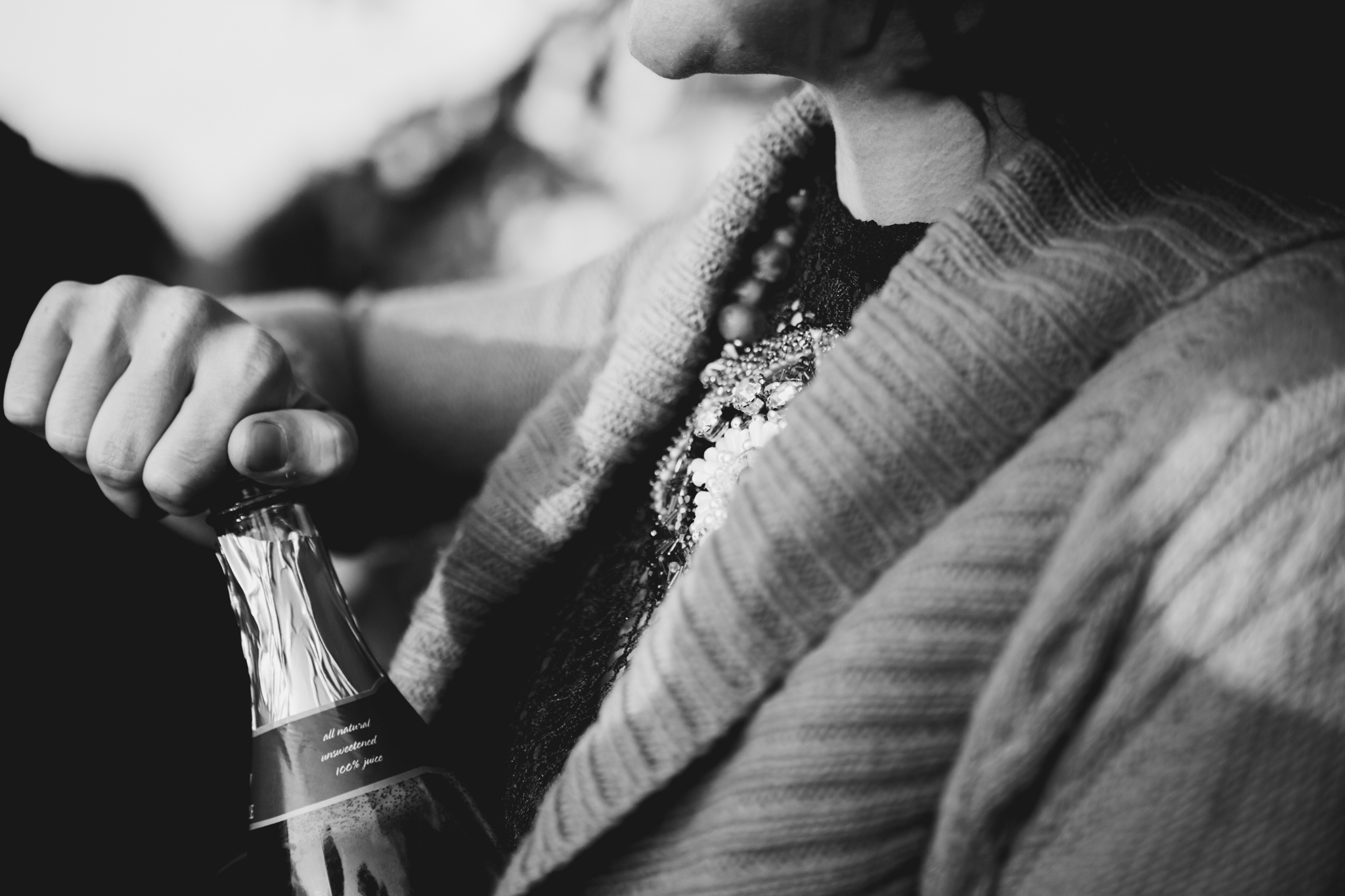 Close up of woman's jeweled shirt while popping champagne Robyn Nicole Film + Photo Portland Maine