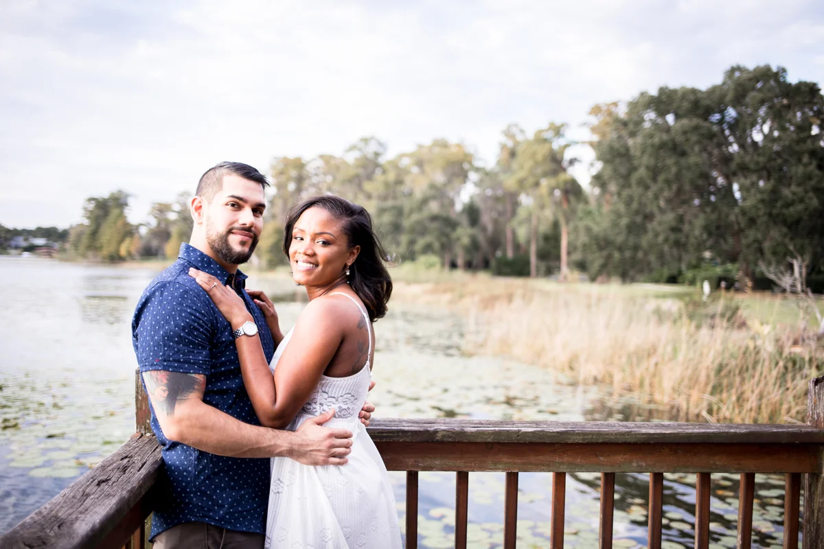 CYPRESS GROVE ENGAGEMENT SESSION CRYSTAL LILY PHOTOGRAPHY COUPLE ON DOCK OVER LAKE