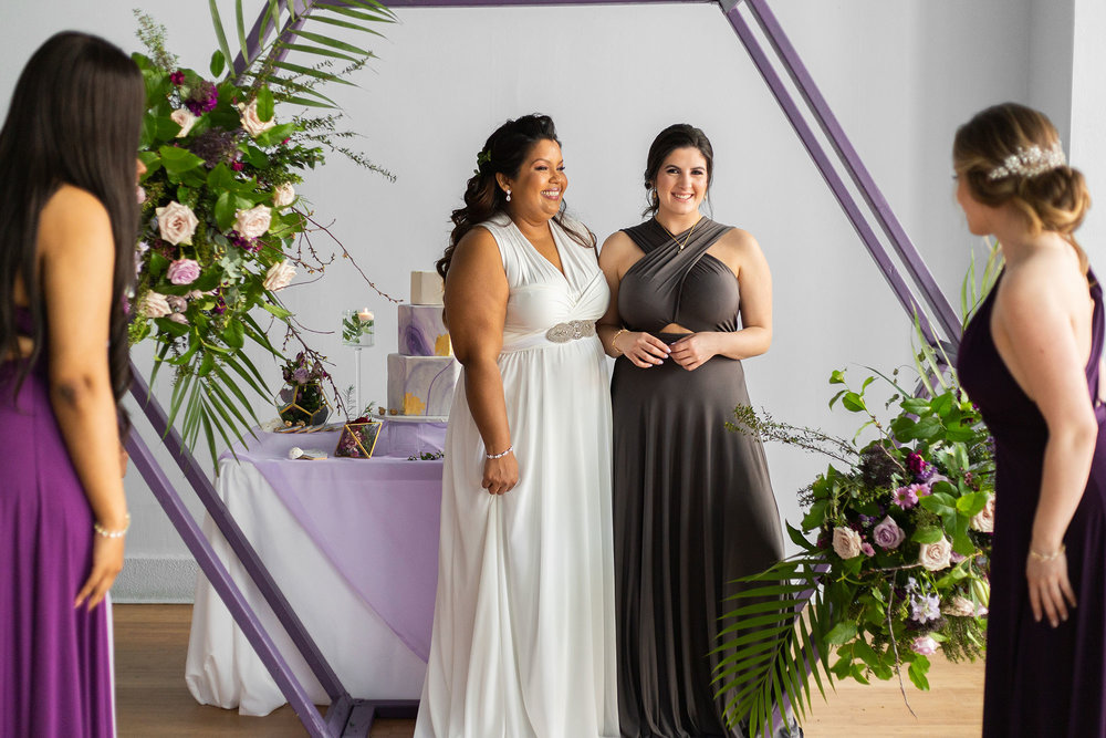 Henkaa fall wedding collection with bride in white and bridesmaid in gray