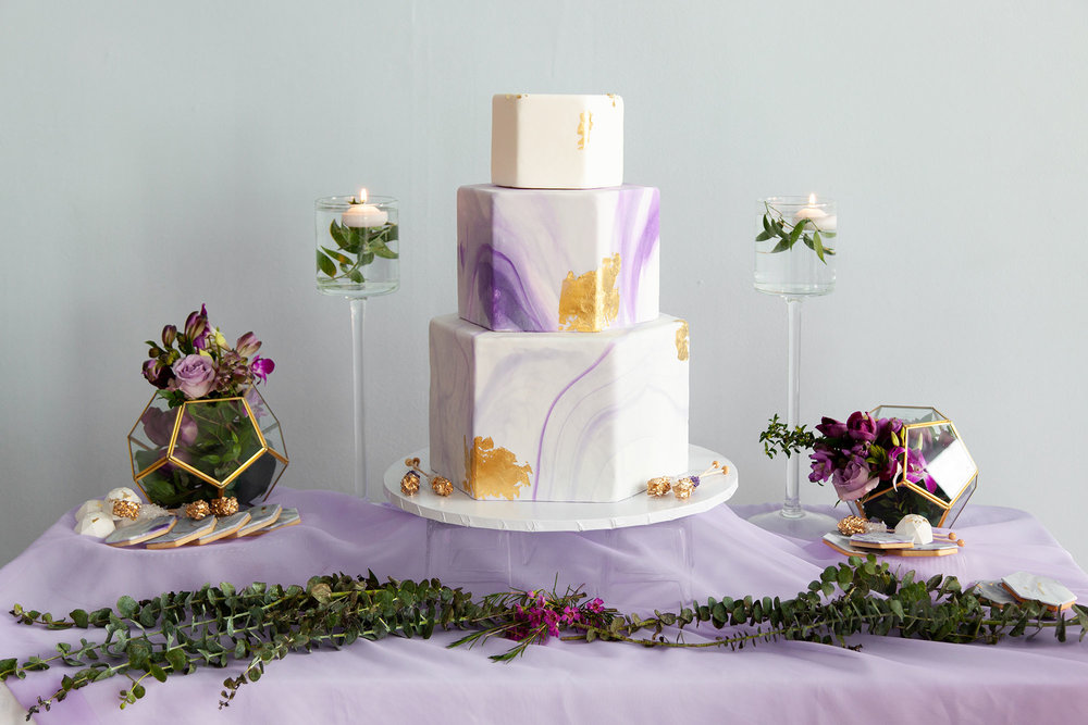 Henkaa fall wedding collection with purple and gold hexagon three tier wedding cake