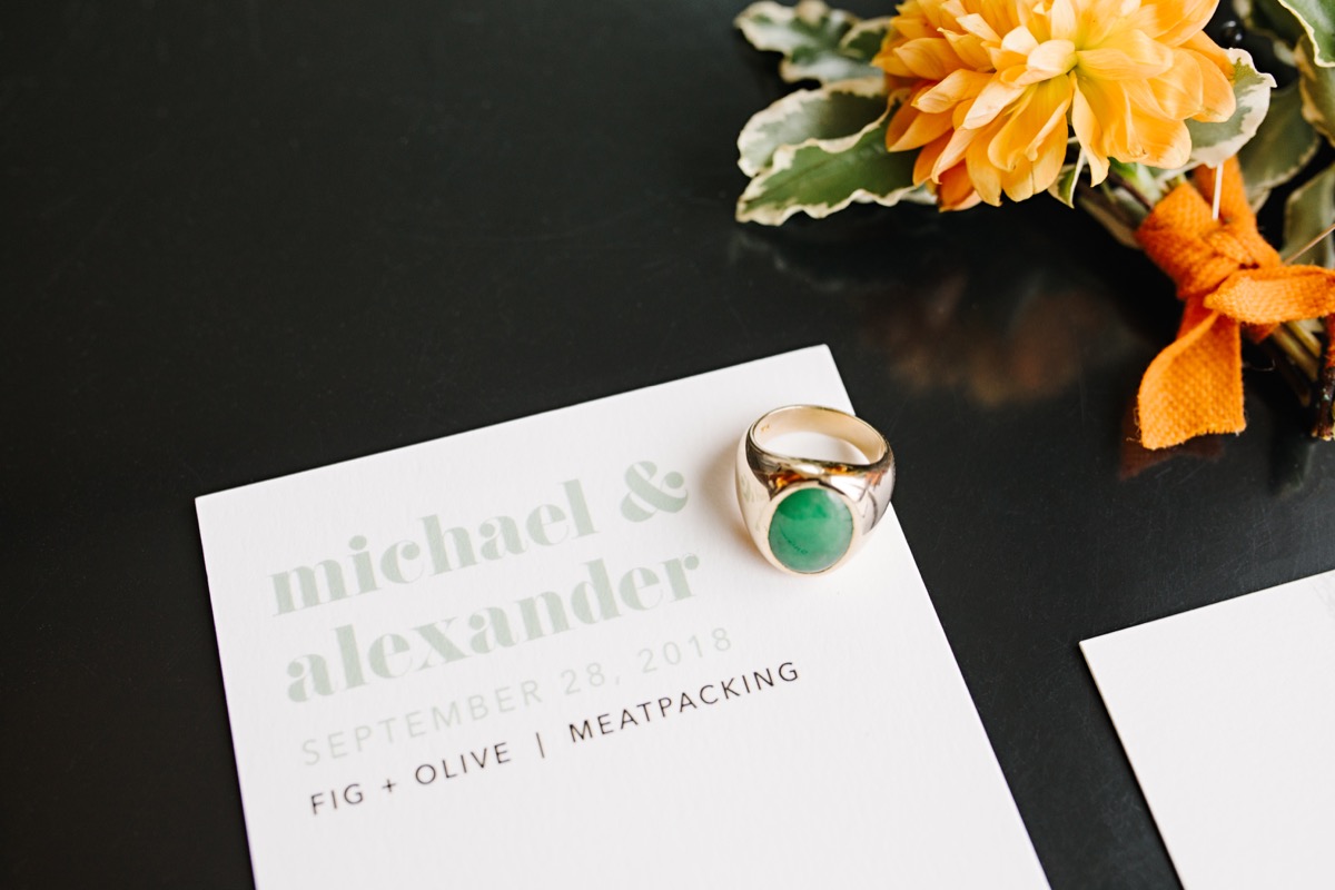 modern mediterranean wedding meatpacking district new york city rima brindamour photography invitation with jade and gold ring