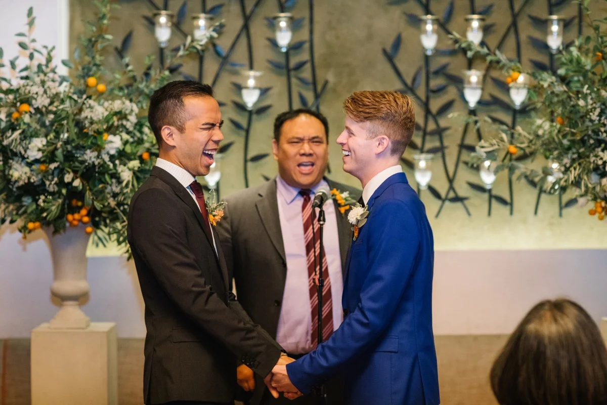 modern mediterranean wedding meatpacking district new york city rima brindamour photography alex and michael laughing during ceremony