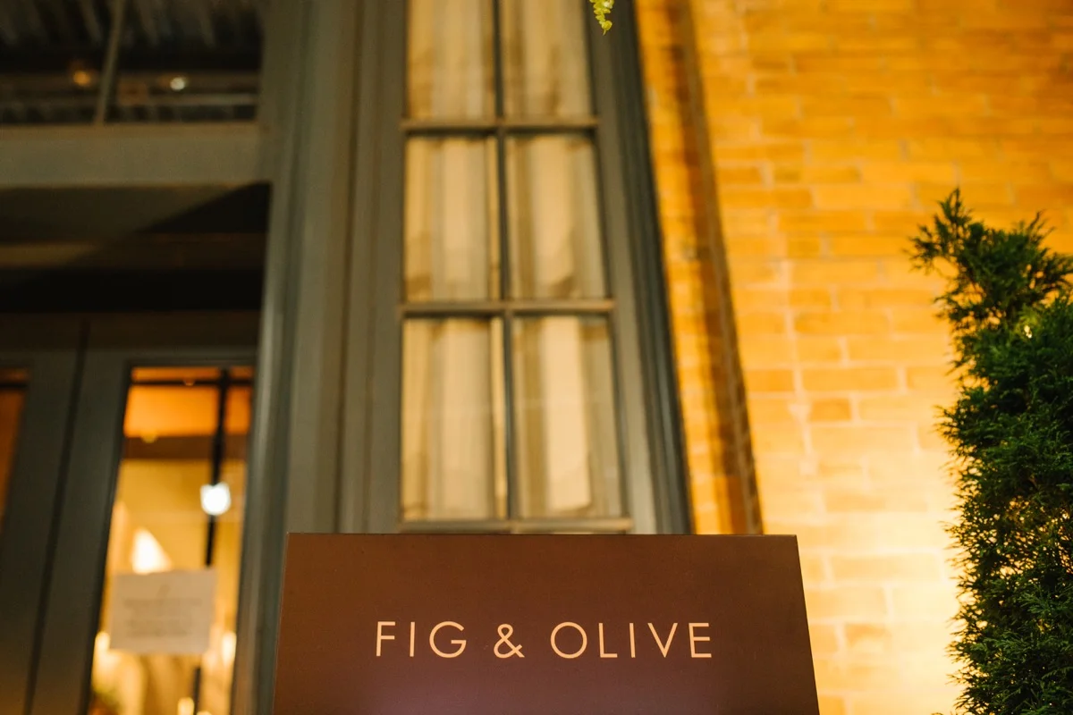 modern mediterranean wedding meatpacking district new york city rima brindamour photography fig and olive restaurant sign