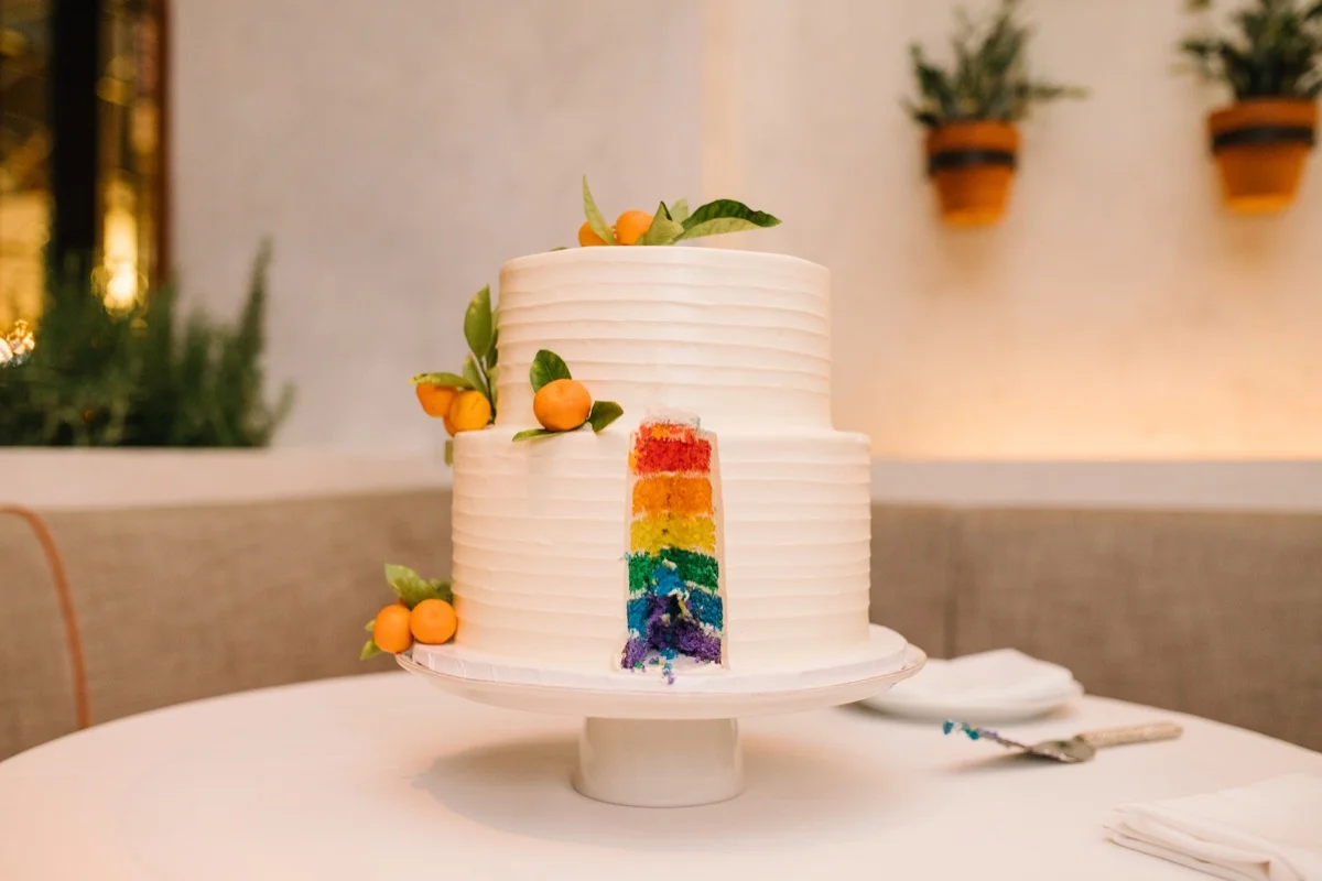 modern mediterranean wedding meatpacking district new york city rima brindamour photography cake with slice cut out