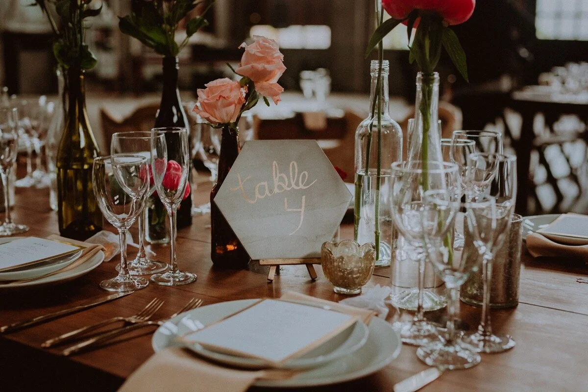 Guest table four place setting for reception at industrial wedding venue in Hudson New York Chellise Michael Photography