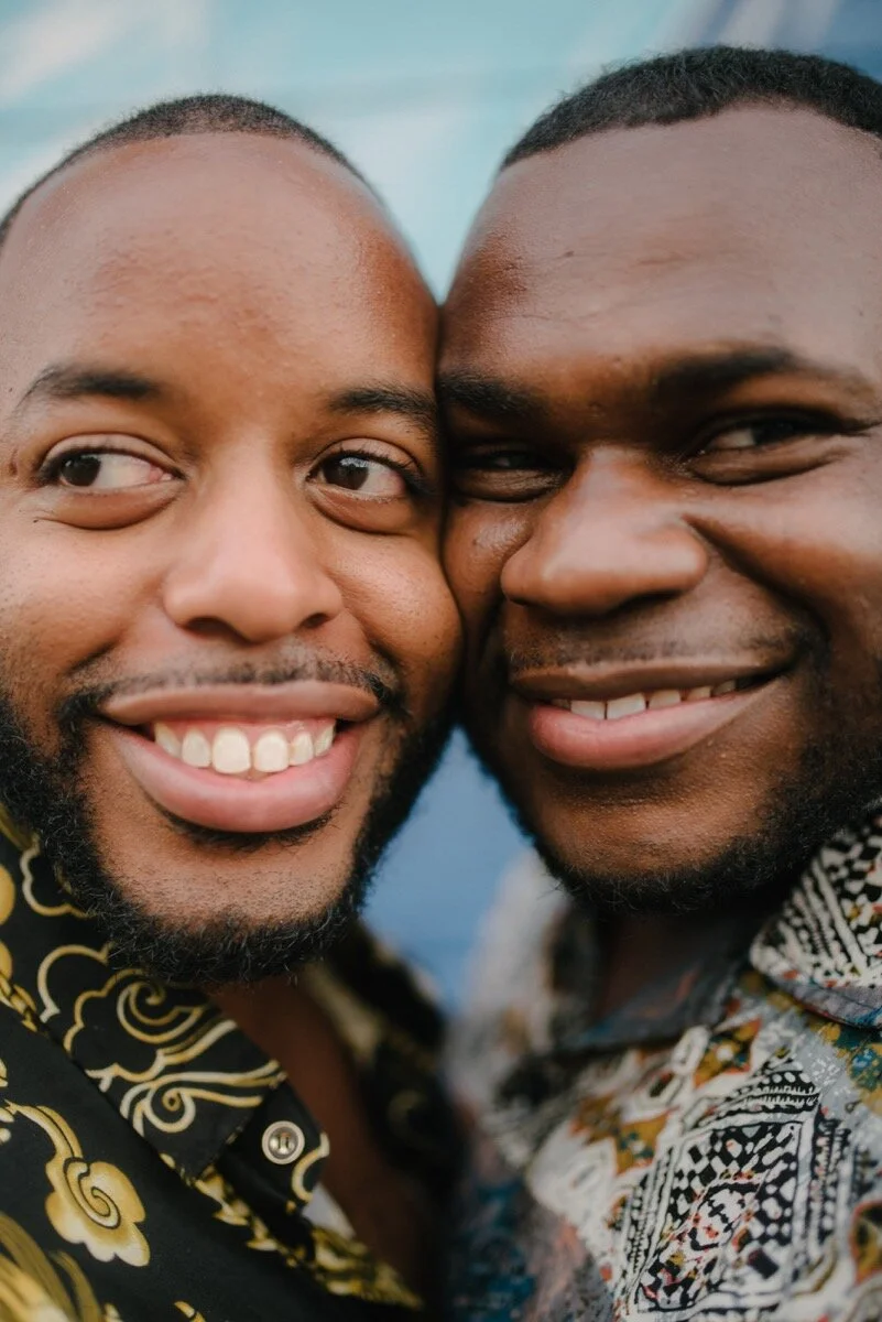 Chris and Nate cheek to cheek after surprise proposal at sugar bakeshop denver colorado Friends and Lovers Photography