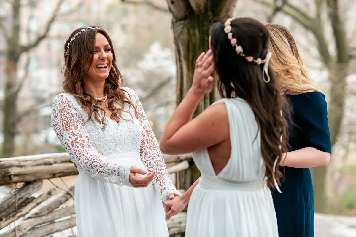 brides smiling during elopement ceremony in NYC Central Park DAG Images