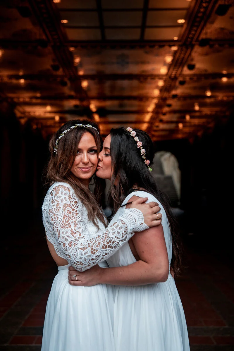 brides embrace elopement ceremony in NYC Central Park DAG Images