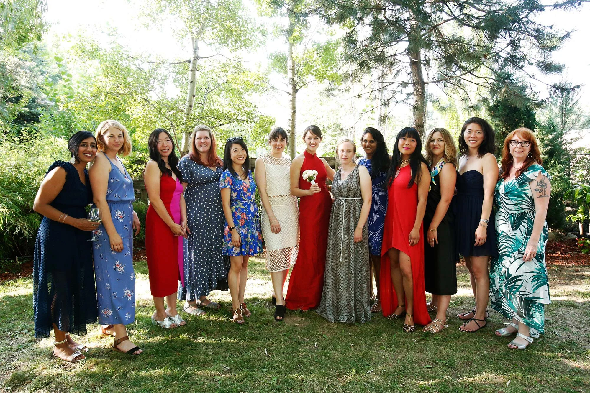 Cathy wearing a variation of a qipao at her wedding in New York surrounded by friends Leslie Rodriguez Photography