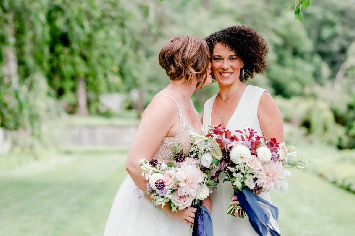 Celestial and Geode wedding inspiration in Winston Salem NC showing two brides in wedding dresses with bouquets Ariel Kaitlin Photography