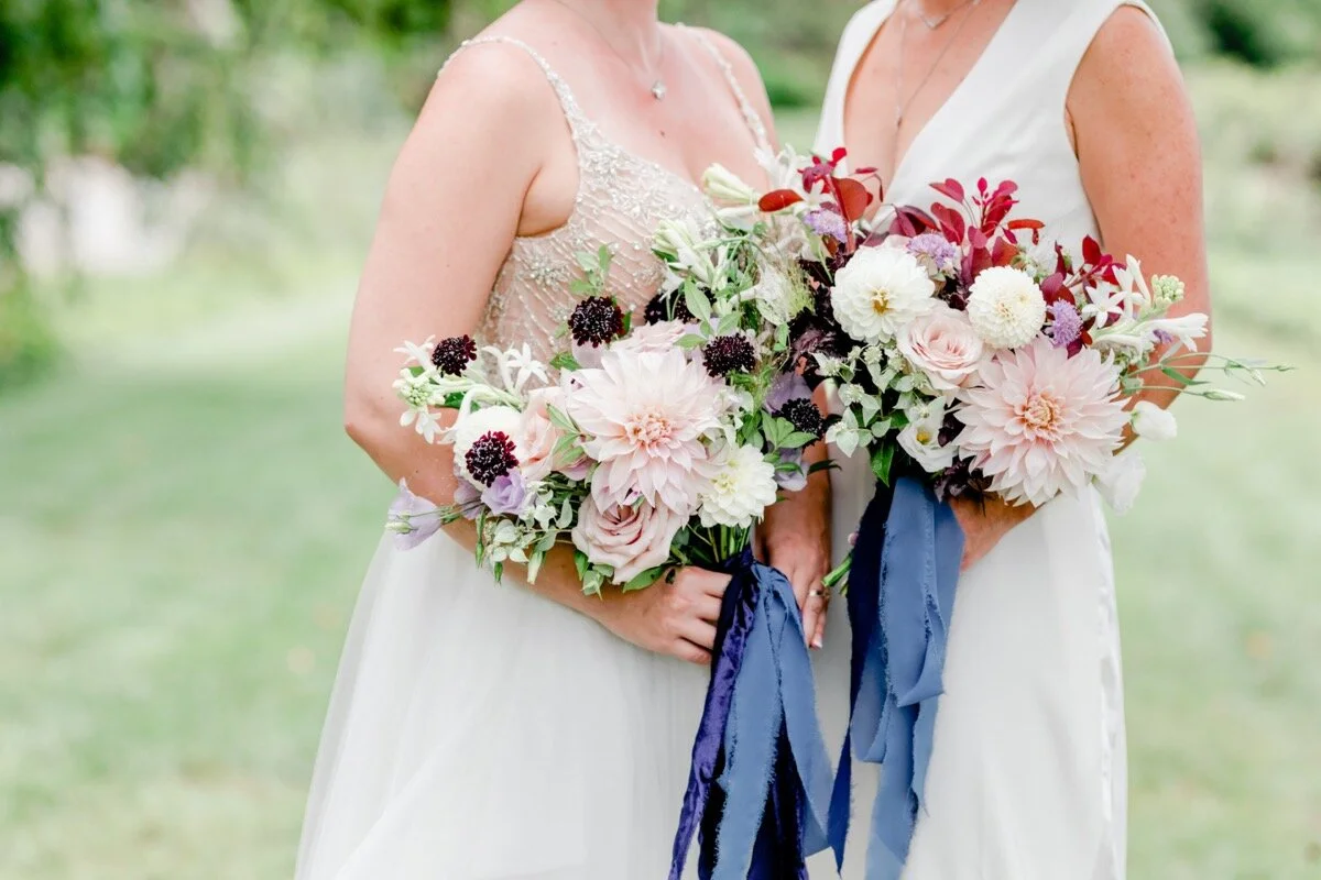Celestial and Geode wedding inspiration in Winston Salem NC showing two brides in wedding dresses with bouquets Ariel Kaitlin Photography