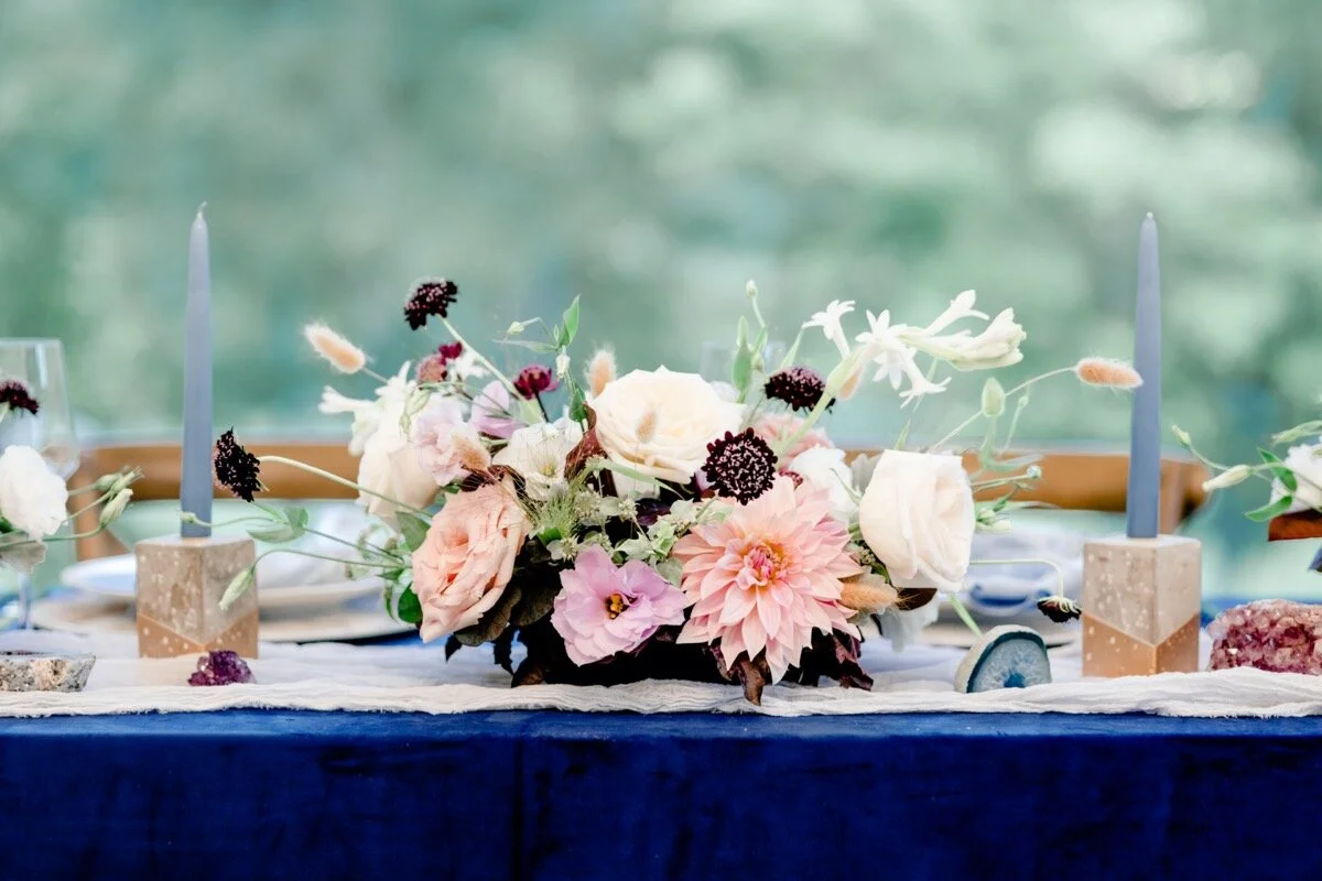 Celestial and Geode wedding inspiration in Winston Salem NC showing floral centerpiece on blue purple and gold head reception table Ariel Kaitlin Photography