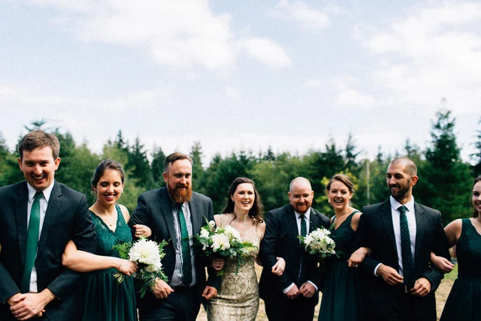Marriers and Wedding Party in a field after ceremony in Seattle Fuck Yeah Weddings