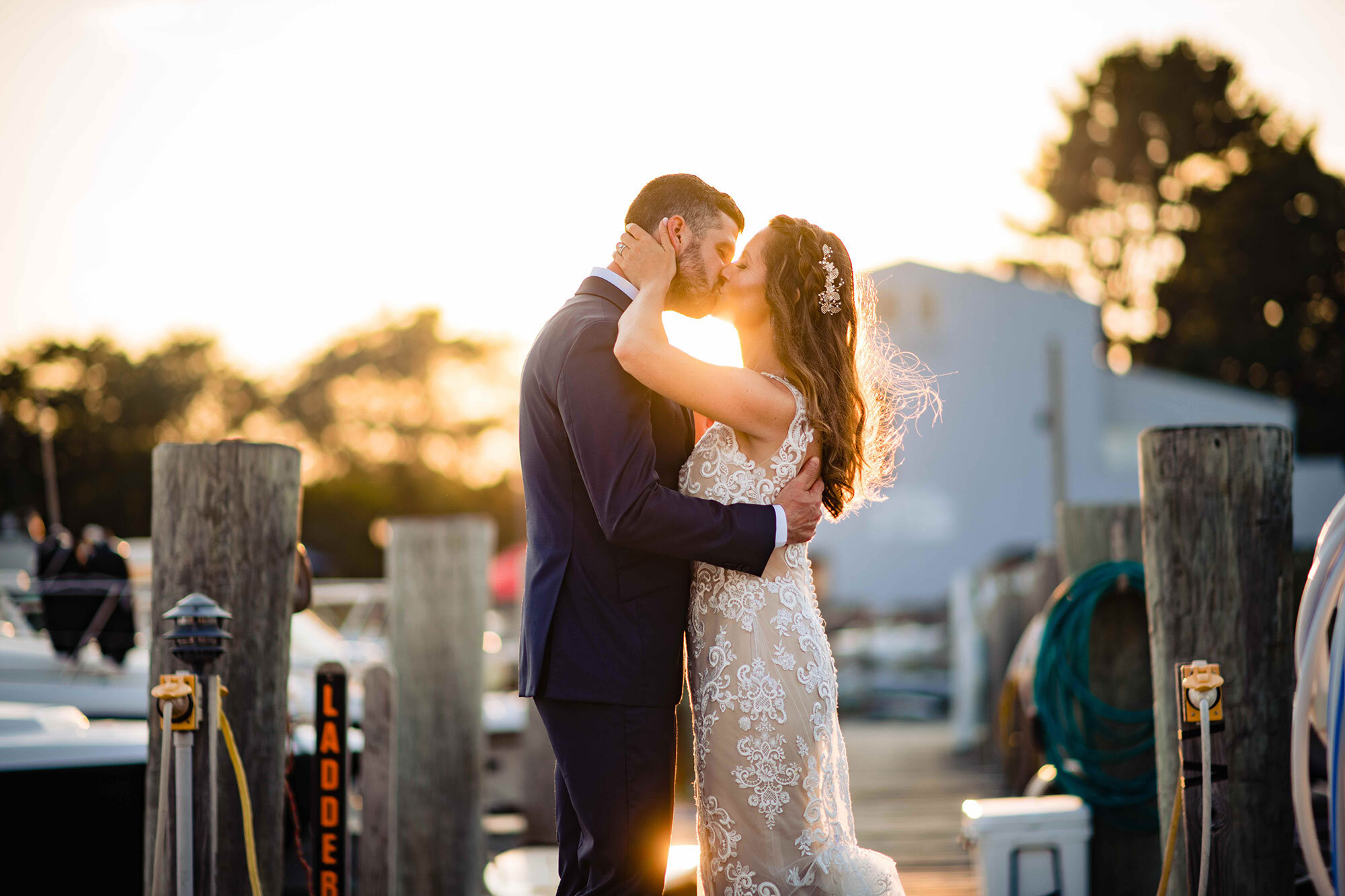 Newlyweds kiss during sunset after their wedding ceremony Teresa Johnson Connecticut Wedding Photographer