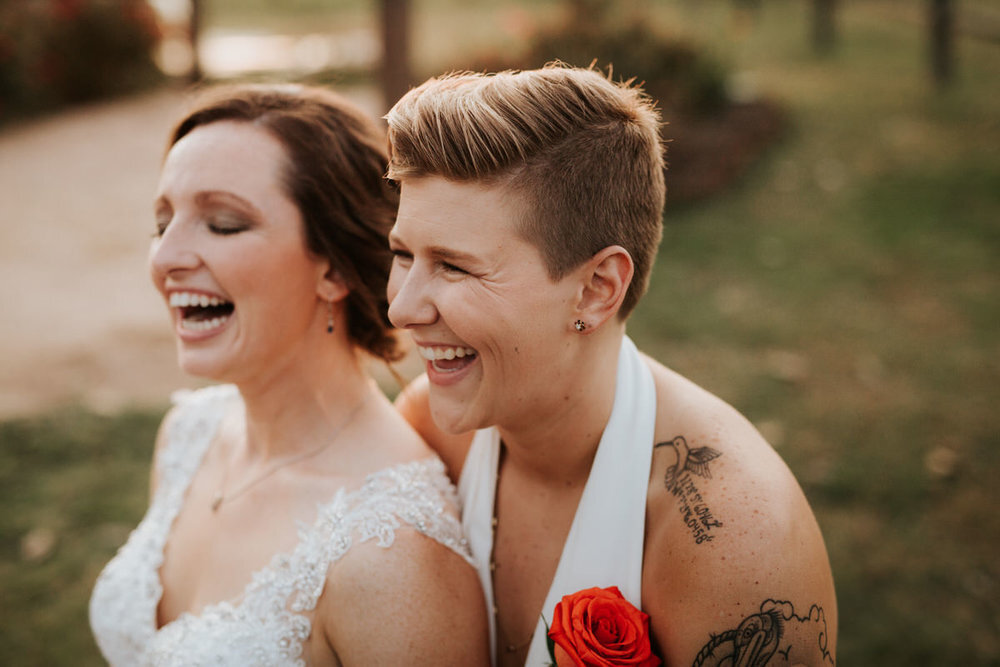 Newlywed LGBTQ+ couple laugh together Diana Ascarrunz Austin Texas Wedding Photographer