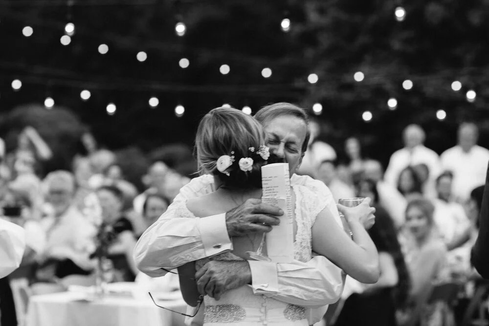 Bride hugs wedding guest during reception Richmond Virginia Betty Clicker Photography Richmond Virginia Betty Clicker Photography