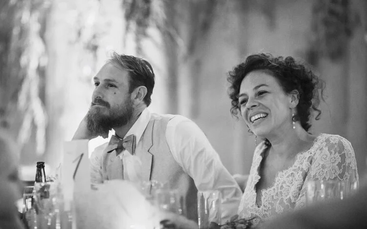 Bride and Groom look on at their guests during wedding reception Richmond Virginia Betty Clicker Photography