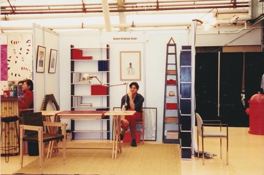 Twenty-five years ago this month, I came to ICFF with four pieces and a chair.

The booth was small. The four objects standing in it were the first sentences of a working vocabulary I&rsquo;m still writing.

Behind me in the photo are the first two p