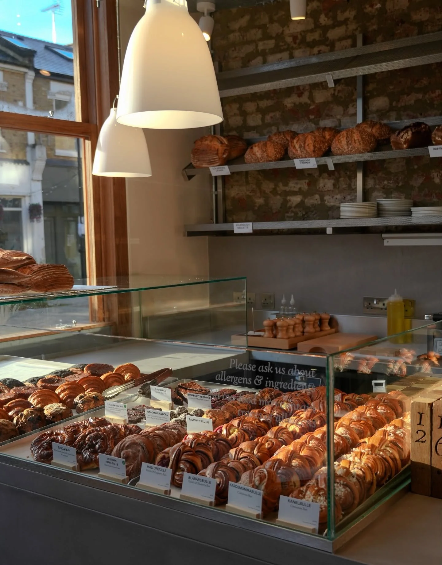 Good morning! The buns are stacked high, soft and golden, ready to start the day ☀️🥐 Come by and say hi!