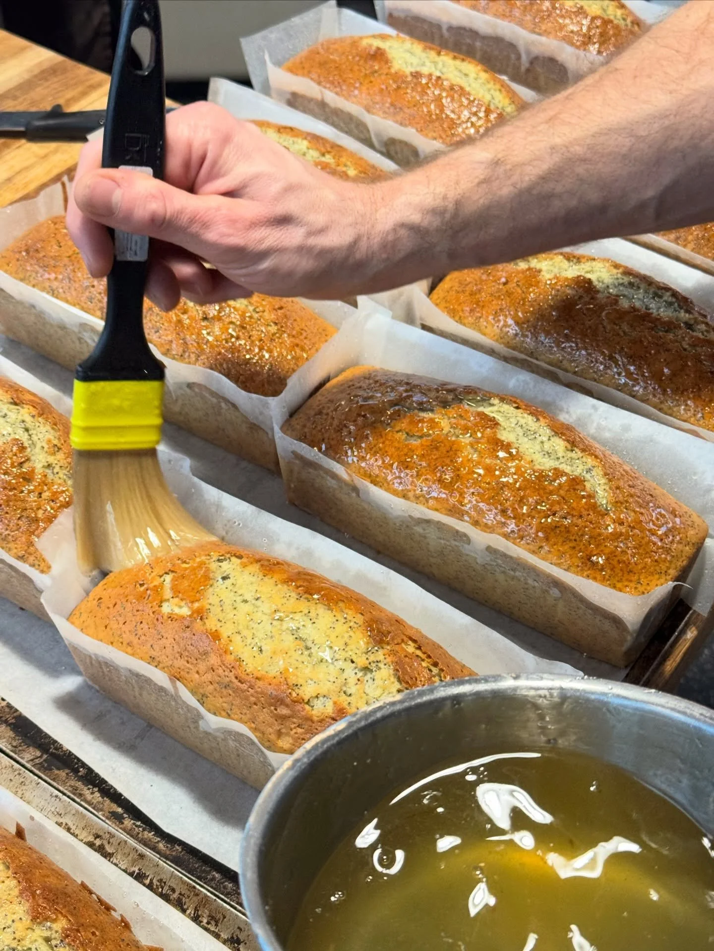 Adding the finishing touch: lemon and sugar syrup for that perfect glaze 🍋✨