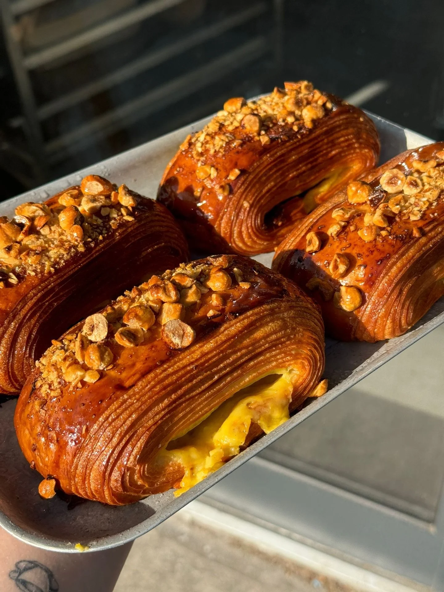 New pain suisse filled with an orange cr&egrave;me pat, gianduja and dark chocolate, finished with roasted hazelnuts

📍London only