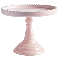 LARGE BLUSH CAKE STAND This blush ceramic cake stand offers a subtle femininity to any display. It's 10.5 inches in diameter and 8.5 inches high with a 9 inch serving surface.