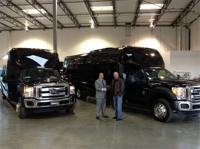 Grech Motors CEO Ed Grech with Michael S. Kusher, VP of Wilshire Limousine Services. Wilshire added GM33 luxury shuttle buses to their high-end Los Angeles fleet.