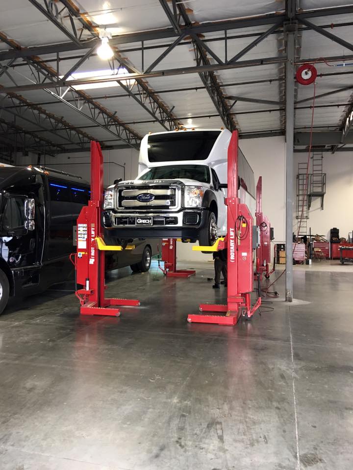 Grech Motors F-550 GM33 on a bus lift undergoing quality control checks and maintenance.