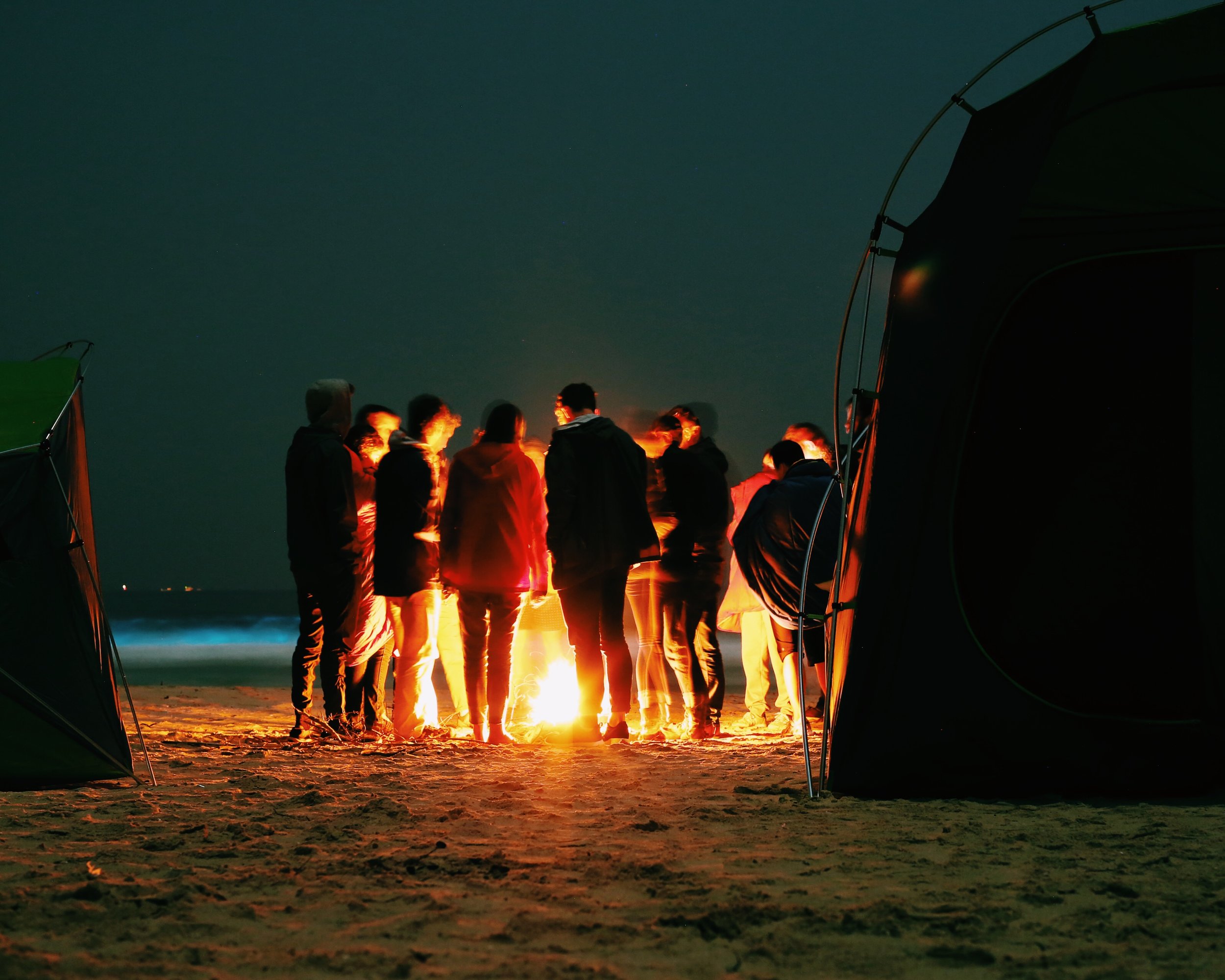 Camping in Hong Kong - the bright blue in the background is phosphorescent sealife in the water!