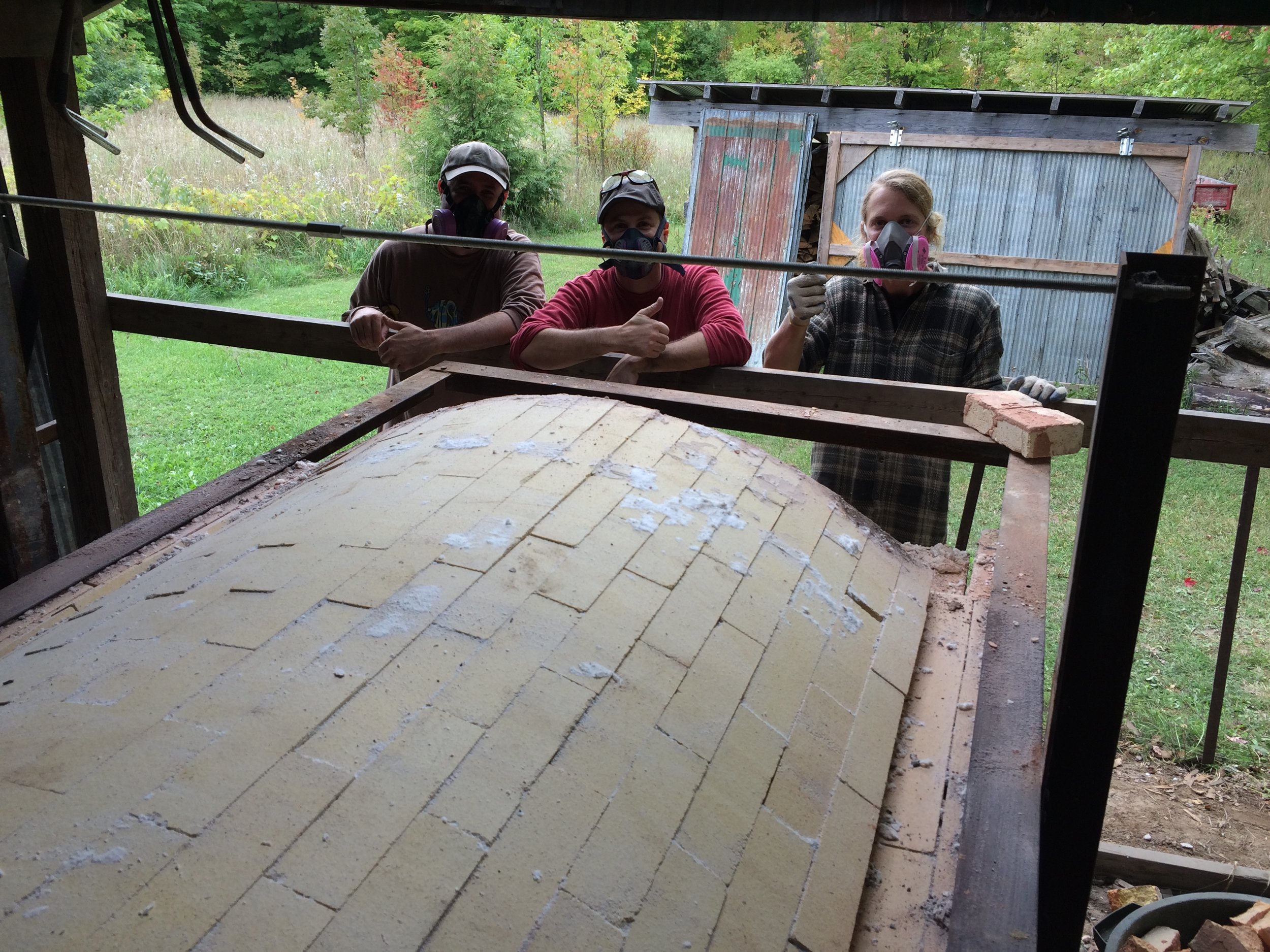 The guys.. demonstrating safe kiln removal wear (ie. respirators)