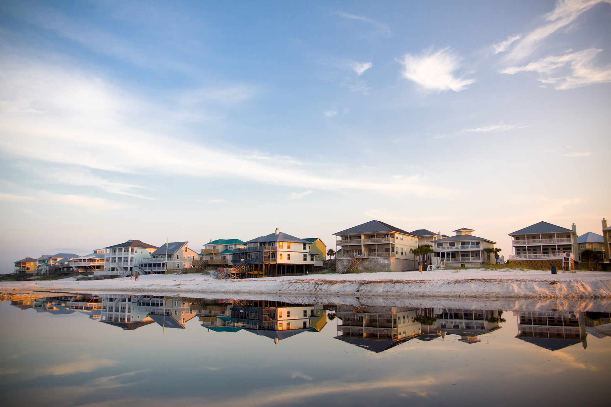 Beach houses reflected in the tide pool.