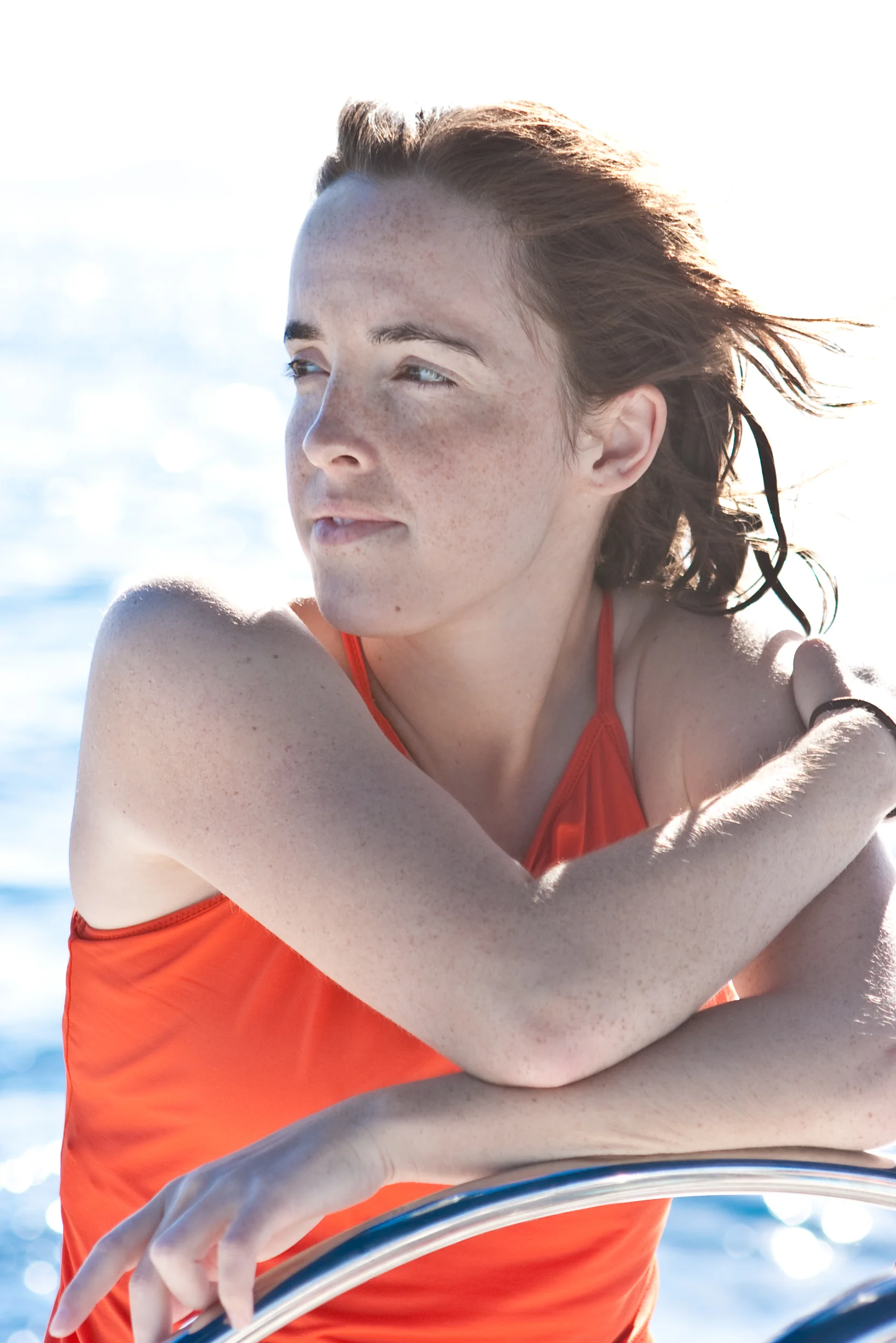 Portrait of a female sailboat captain at the helm.