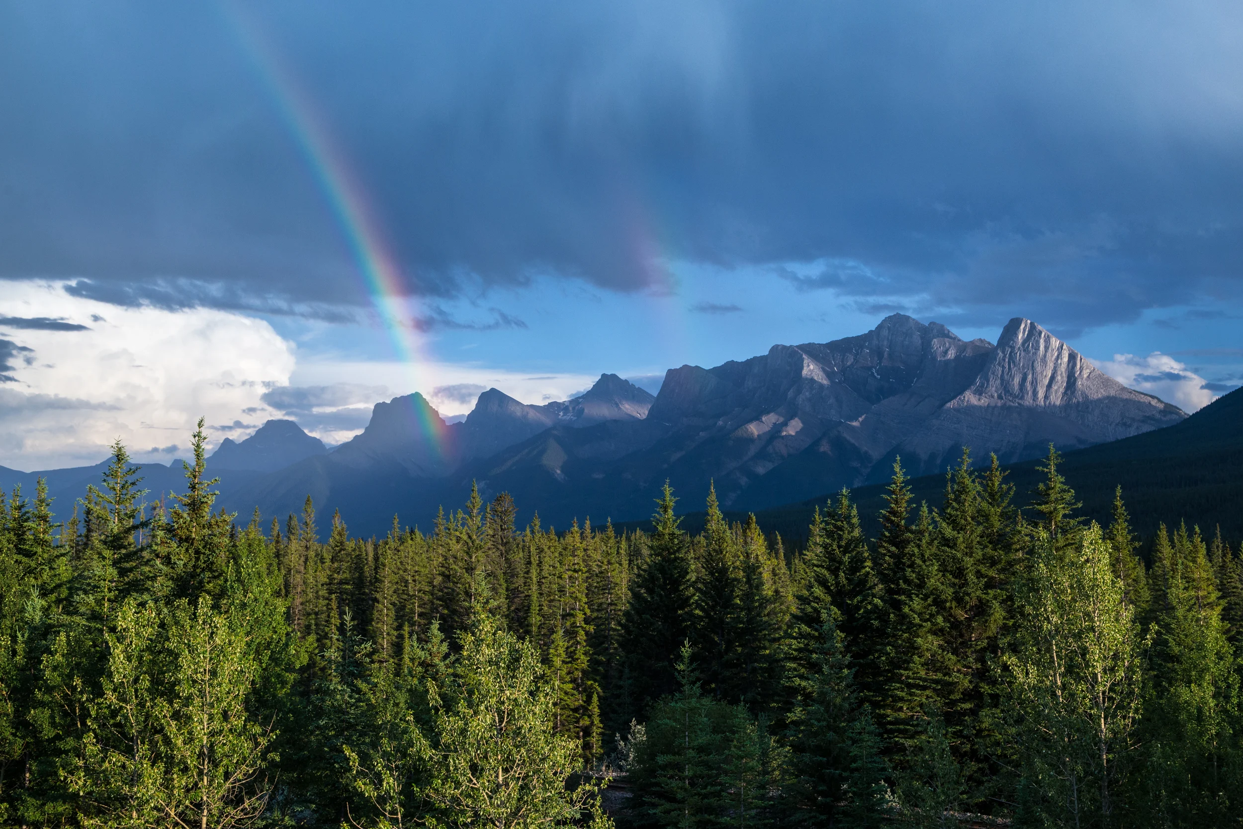 Rainbow over the Three Sisters in Canmore.