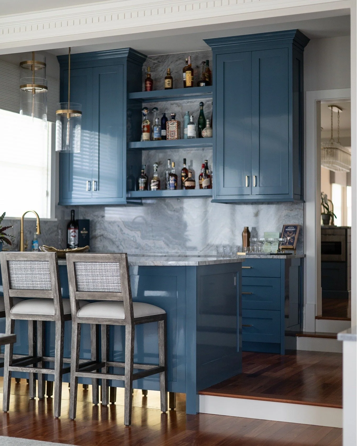 Reimagined spaces are some of our favorites. 

What was once a blank, overlooked wall between the kitchen and dining area is now a beautifully custom-built bar designed for gathering. Thoughtful cabinetry, layered finishes, and functional storage tra