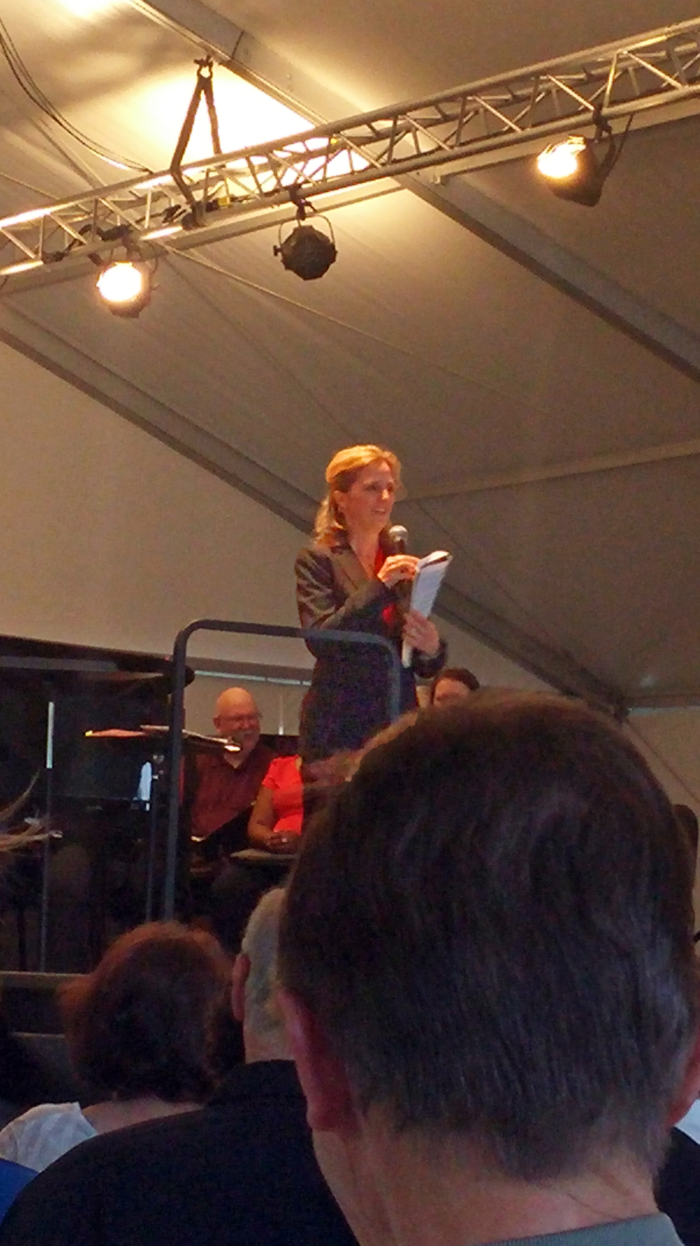 Erin introduces three of Rossini's sins to the audience: a silly piece about Venetian gondoliers, a literal cat fight, and a mass with humor! Photo credit: John Taylor 