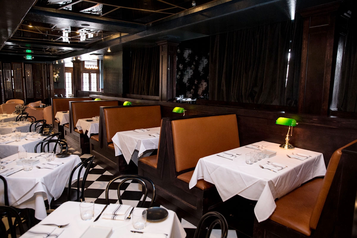 "CATALONIA" DINING ROOM Located in the heart of the restaurant, the Main Dining Room features bistro dining tables flanked on both sides by custom wood and leather booths and communal farm tables at the back. Seats up to 84 guests.