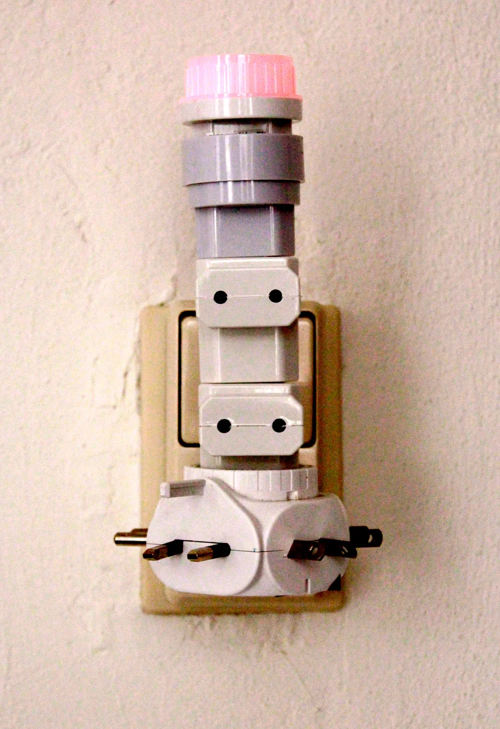 Those adaptors sculptures are also a tribute to GAMBIARRA, a Brazilian slang for a creative, low-cost solution to problems. I grew up surrounded by gambiarras at my house. Electric improvisations to make things work a bit more. The lack of electricity plugs stimulated the use of many adaptors to turn on as many electronic devices as possible. It was always exciting to see if it was going to work at all.
