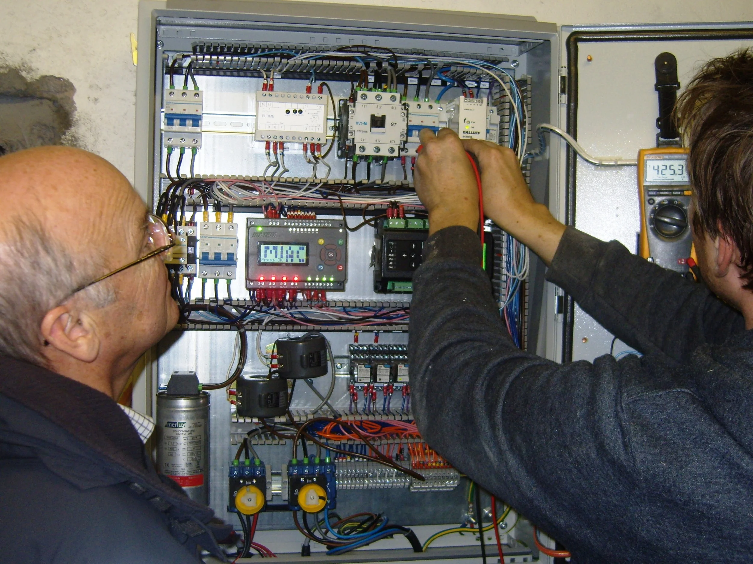 Rod Smith (l) with David Postlethwaite of Border Hydro (r) at the control panel during commissioning