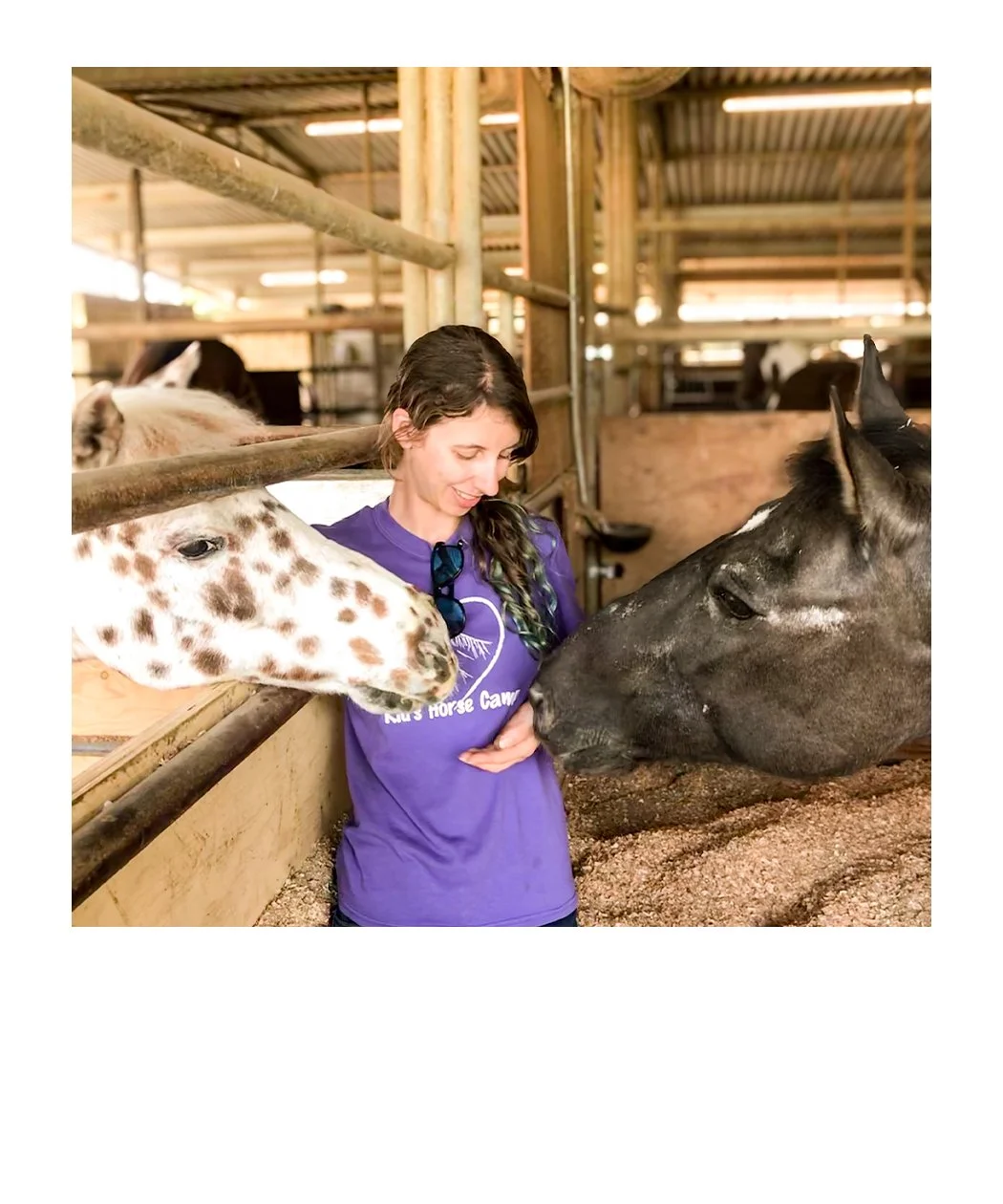 graphic designer and illustrator maria decerce in a barn with two ponies