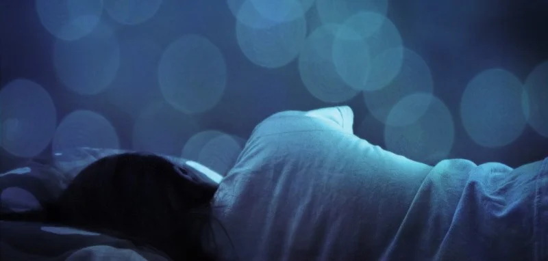 sleeping with blue bokeh in background.jpg