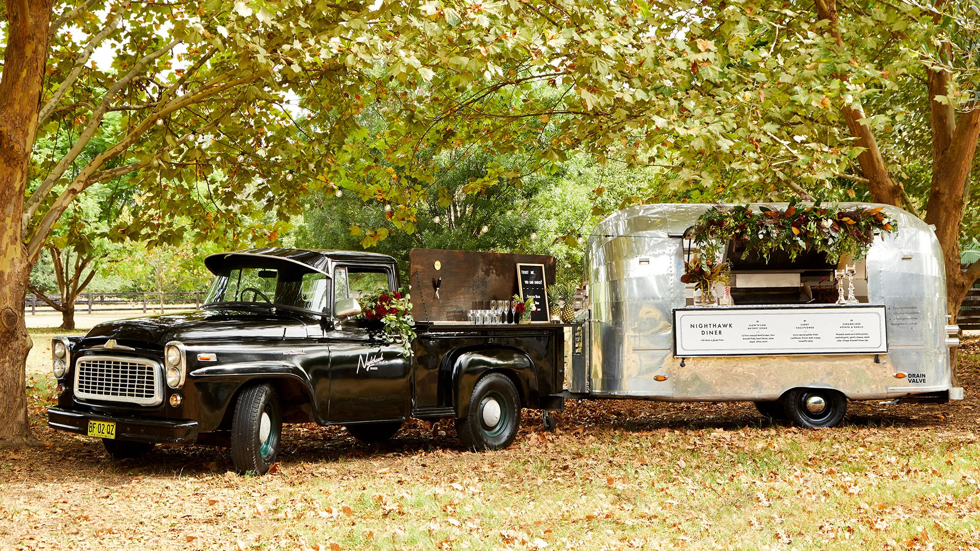 Vintage Food Trucks Selling American Burgers And Tacos