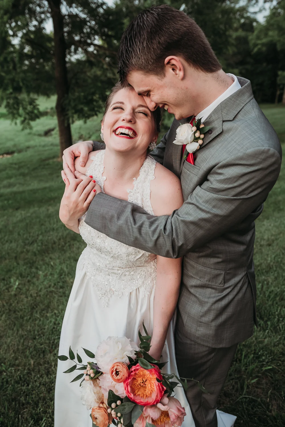 bride-groom-laughing-in-field-1.jpg