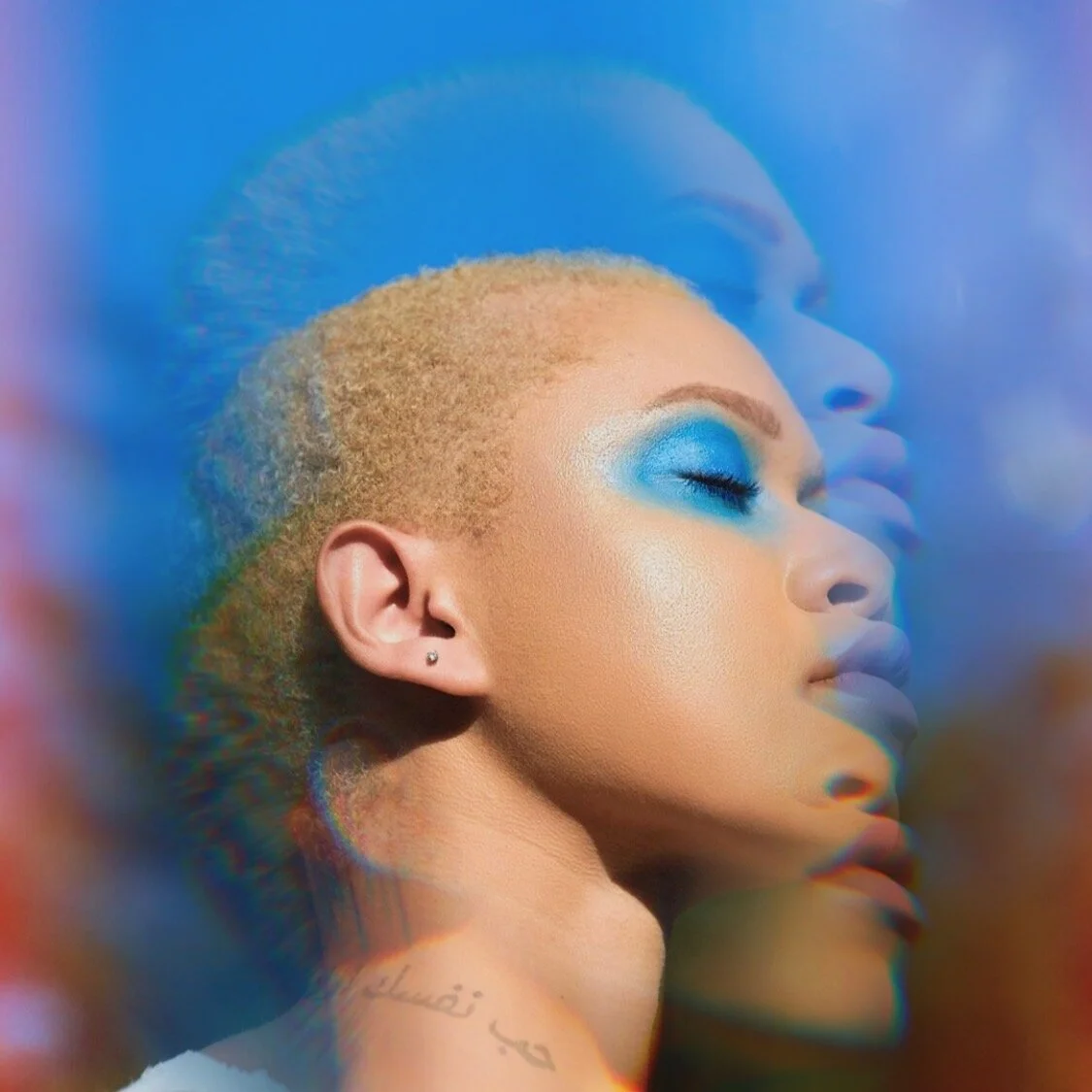 Close-up of a woman with short blonde hair and bright blue eye makeup, with a double-exposure effect showing her face in different shades.