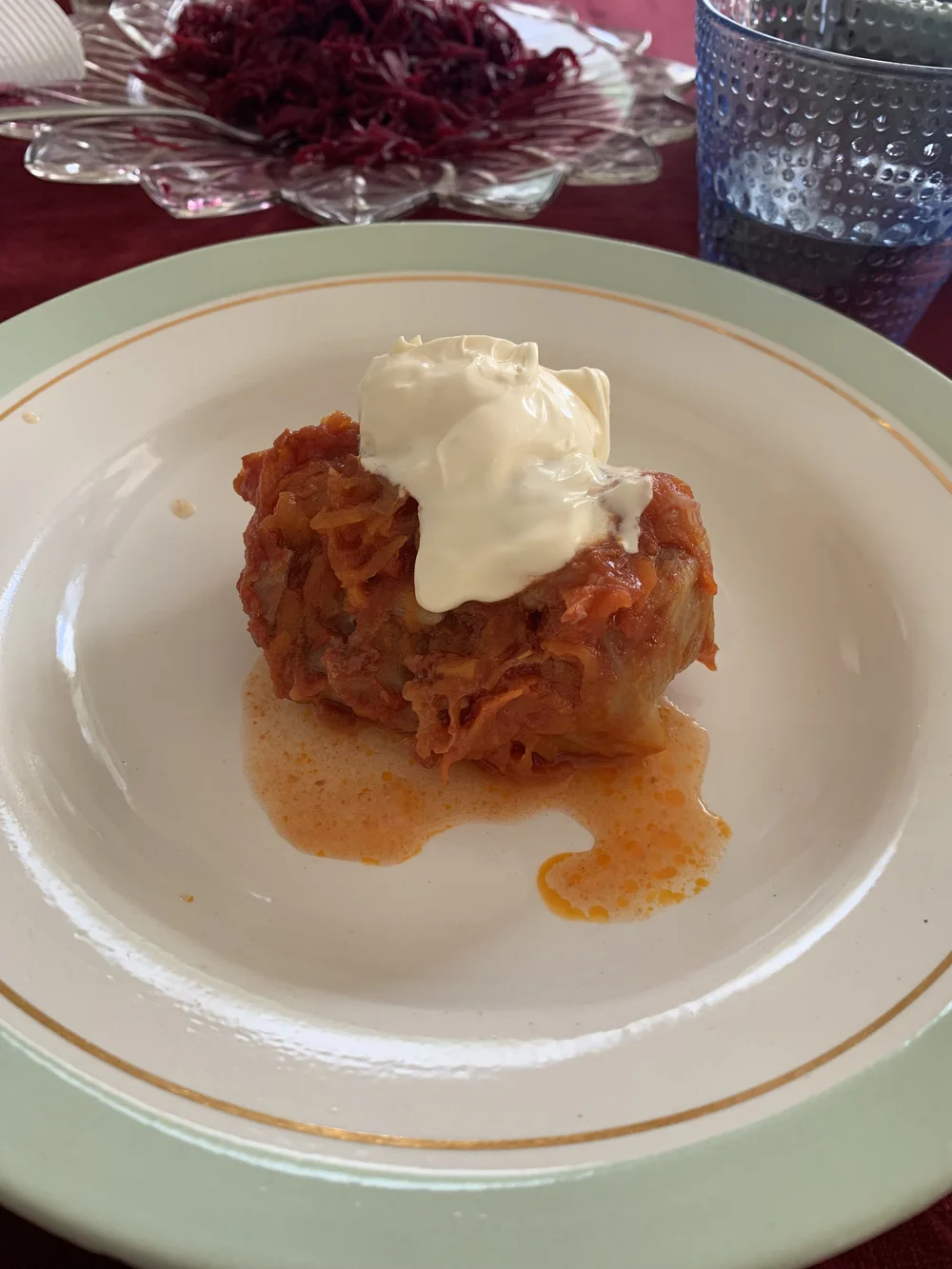 Cabbage roll served with sour cream
